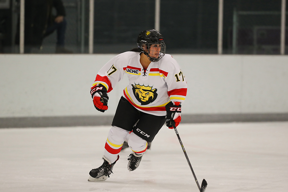 a hockey player is seen skating on an ice risk