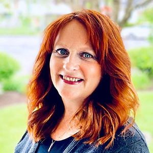 Portrait photo of Judie Burridge in professional attire.