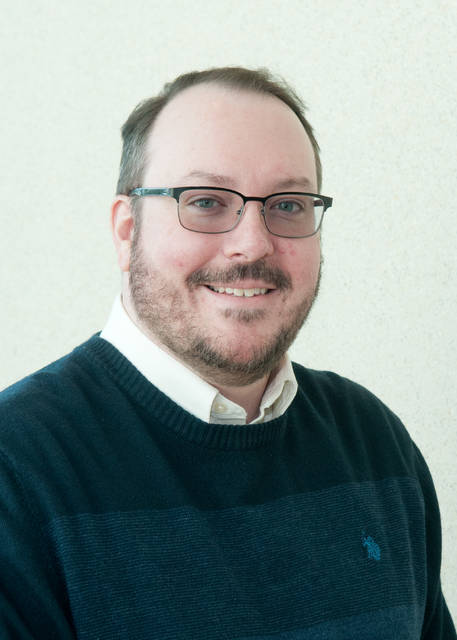portrait of Chris Aults in professional attire.