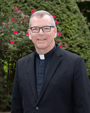 portrait photo of Fr. Looney