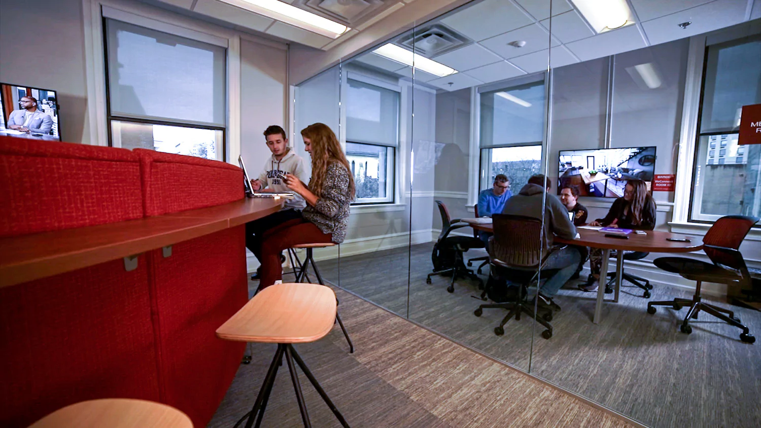 Students sit on stools in the Mulligan engineering center.