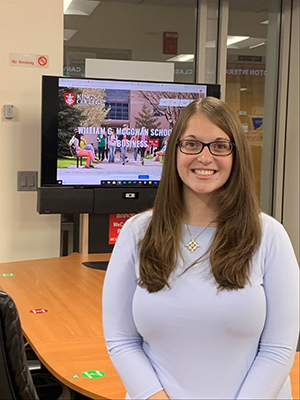 Jessica poses for a photo in a computer lab in the McGowan School of Business.