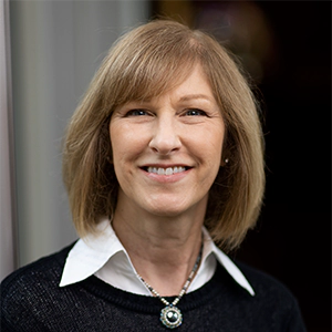 Portrait photo of Carol Simonovich Scholl in professional attire.