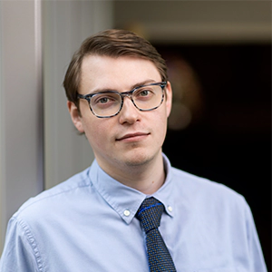 Portrait photo of Ryan Rosenthal in professional attire.