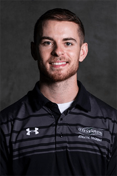 Portrait photo of Cody Lancelotti in a polo shirt.