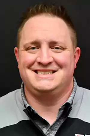 Portrait photo of Jayme in a polo shirt.