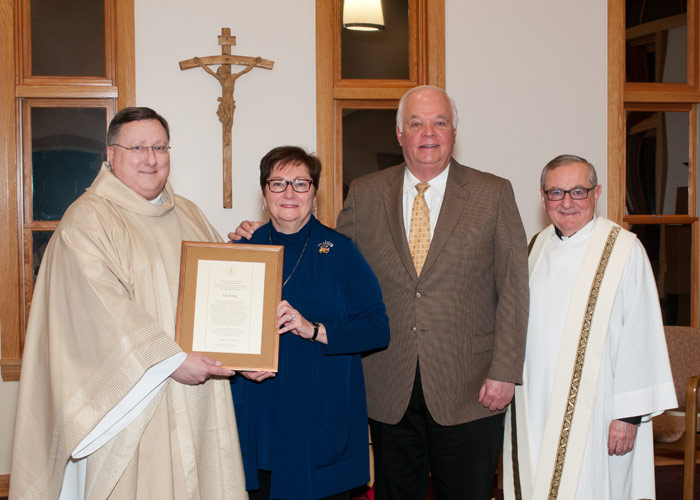 Pictured, from left, is Father Walter Jenkins, C.S.C., superior of the Holy Cross Congregation of priests and brothers at King’s College; Noone; Frank Noone, Anne’s husband; and John Ryan, C.S.C., King’s president.