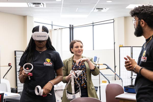 Dr. Patterson teaching OT students Bryanna Nelson and Gunhvir Singh